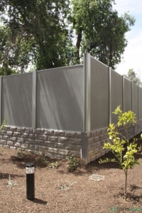 Sleeper retaining wall with acoustic wall fitted to top at Fullarton SA